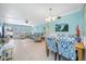 Bright dining area with table and chairs, open to the living room at 5820 43Rd N Ter # 1403, St Petersburg, FL 33709