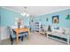 Charming dining area with a table for four and blue accents at 5820 43Rd N Ter # 1403, St Petersburg, FL 33709