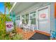 Relaxing front porch with rocking chairs and colorful decor at 5820 43Rd N Ter # 1403, St Petersburg, FL 33709