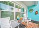 Peaceful front porch featuring rocking chairs and serene decorations at 5820 43Rd N Ter # 1403, St Petersburg, FL 33709