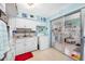 Efficient kitchen with white cabinets and a washer/dryer at 5820 43Rd N Ter # 1403, St Petersburg, FL 33709