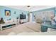 Spacious living area featuring a large TV and relaxing furniture at 5820 43Rd N Ter # 1403, St Petersburg, FL 33709