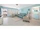 Bright living room with light tile floors and comfy seating at 5820 43Rd N Ter # 1403, St Petersburg, FL 33709