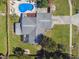 Overhead view of house, pool, and fenced backyard at 612 E Wheeler Rd, Seffner, FL 33584