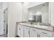 Modern bathroom with granite countertop and double vanity at 7139 Steer Blade Dr, Zephyrhills, FL 33541