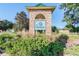 Community entrance sign with landscaping at 7139 Steer Blade Dr, Zephyrhills, FL 33541