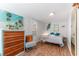 Charming bedroom with light walls, modern decor, and wood look flooring at 727 53Rd N Ter, St Petersburg, FL 33703