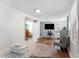 Comfortable bedroom featuring modern decor, wood floors, and a well-lit workspace at 727 53Rd N Ter, St Petersburg, FL 33703