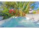 A refreshing hot tub with tropical landscaping creating a private and relaxing outdoor oasis at 727 53Rd N Ter, St Petersburg, FL 33703