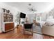 Well-lit living room features a fireplace, hardwood floors, and eclectic decor at 727 53Rd N Ter, St Petersburg, FL 33703