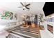 Stylish living room with modern furnishings, a fireplace, and an open concept layout to the kitchen at 727 53Rd N Ter, St Petersburg, FL 33703
