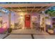 Welcoming front porch with seating, decorative potted plants, and an inviting front door at 727 53Rd N Ter, St Petersburg, FL 33703