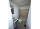 Dated bathroom with tub, toilet, and pedestal sink. Needs updating at 8204 N Klondyke St, Tampa, FL 33604