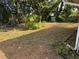 Large backyard with mature trees at 980 5Th Ne Ave, Largo, FL 33770