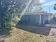 View of backyard with screened porch at 980 5Th Ne Ave, Largo, FL 33770