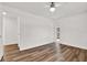 Bright bedroom with wood-look floors, white walls, ceiling fan, and natural light at 980 5Th Ne Ave, Largo, FL 33770