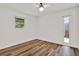 Bedroom showcasing natural light, wood floors, neutral walls, and windows to the outside at 980 5Th Ne Ave, Largo, FL 33770