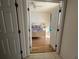 Inviting bedroom showcasing a cozy bed with colorful bedding, side table, and lamps at 11405 Warm Wind Way, Weeki Wachee, FL 34613