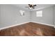 Spacious bedroom with wood floors and neutral walls at 1272 Lady Marion Ln, Dunedin, FL 34698