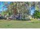 Large backyard with mature trees and a shed at 13515 Gavin Rd, Dover, FL 33527