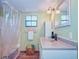 Clean bathroom with double vanity and shower/tub combo at 13515 Gavin Rd, Dover, FL 33527