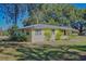 Ranch-style home with a large yard and trees at 13515 Gavin Rd, Dover, FL 33527