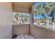 Private balcony overlooking lush tropical landscaping at 1630 Royal Palm S Dr # A, St Petersburg, FL 33707