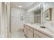 Bright bathroom with a vanity, toilet and shower. Tile flooring and walls at 1630 Royal Palm S Dr # A, St Petersburg, FL 33707