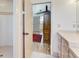 Bathroom with a walk-in shower and access to another bedroom at 1630 Royal Palm S Dr # A, St Petersburg, FL 33707
