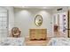 Guest bedroom with twin beds, dresser, and views to another room at 1630 Royal Palm S Dr # A, St Petersburg, FL 33707