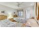 Guest bedroom with two twin beds, dresser, and hardwood floors at 1630 Royal Palm S Dr # A, St Petersburg, FL 33707
