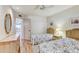 Guest bedroom with two twin beds and access to the balcony at 1630 Royal Palm S Dr # A, St Petersburg, FL 33707