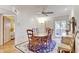 Spacious dining room with hardwood floors and access to a patio at 1630 Royal Palm S Dr # A, St Petersburg, FL 33707