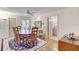 Bright dining room featuring hardwood floors and access to a bathroom at 1630 Royal Palm S Dr # A, St Petersburg, FL 33707