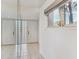 Bright entryway with mirrored wall, double doors and a window with blinds at 1630 Royal Palm S Dr # A, St Petersburg, FL 33707