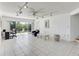 Spacious Gathering room with tiled floors, sliding doors to a patio and water view at 1630 Royal Palm S Dr # A, St Petersburg, FL 33707