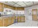 Bright kitchen with granite countertops and stainless steel appliances at 1630 Royal Palm S Dr # A, St Petersburg, FL 33707