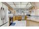 Spacious kitchen featuring granite countertops and wood cabinets at 1630 Royal Palm S Dr # A, St Petersburg, FL 33707