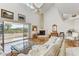 Spacious living area with hardwood floors, fireplace, and high ceilings at 1630 Royal Palm S Dr # A, St Petersburg, FL 33707