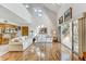 Open living space with hardwood floors, fireplace, and kitchen views at 1630 Royal Palm S Dr # A, St Petersburg, FL 33707