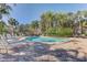 Inviting community pool with lounge chairs and lush landscaping at 1630 Royal Palm S Dr # A, St Petersburg, FL 33707