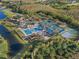 Aerial view of community amenities including pool and tennis courts at 19301 Sandy Springs Cir, Lutz, FL 33558