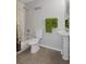 Clean bathroom with tub shower combo and pedestal sink at 19301 Sandy Springs Cir, Lutz, FL 33558