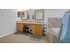 Double vanity bathroom with granite countertops and a soaking tub at 19301 Sandy Springs Cir, Lutz, FL 33558
