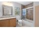 Bathroom with tub, shower, and wood vanity at 19301 Sandy Springs Cir, Lutz, FL 33558