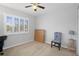Bedroom with window, chair, and small table at 19301 Sandy Springs Cir, Lutz, FL 33558