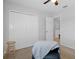 Bedroom with double door closet and access to hall at 19301 Sandy Springs Cir, Lutz, FL 33558