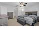 Spacious bedroom with king-size bed and ceiling fan at 19301 Sandy Springs Cir, Lutz, FL 33558