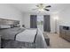 Spacious bedroom with king-size bed and ceiling fan at 19301 Sandy Springs Cir, Lutz, FL 33558
