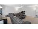Bonus room with sectional sofa and office area at 19301 Sandy Springs Cir, Lutz, FL 33558
